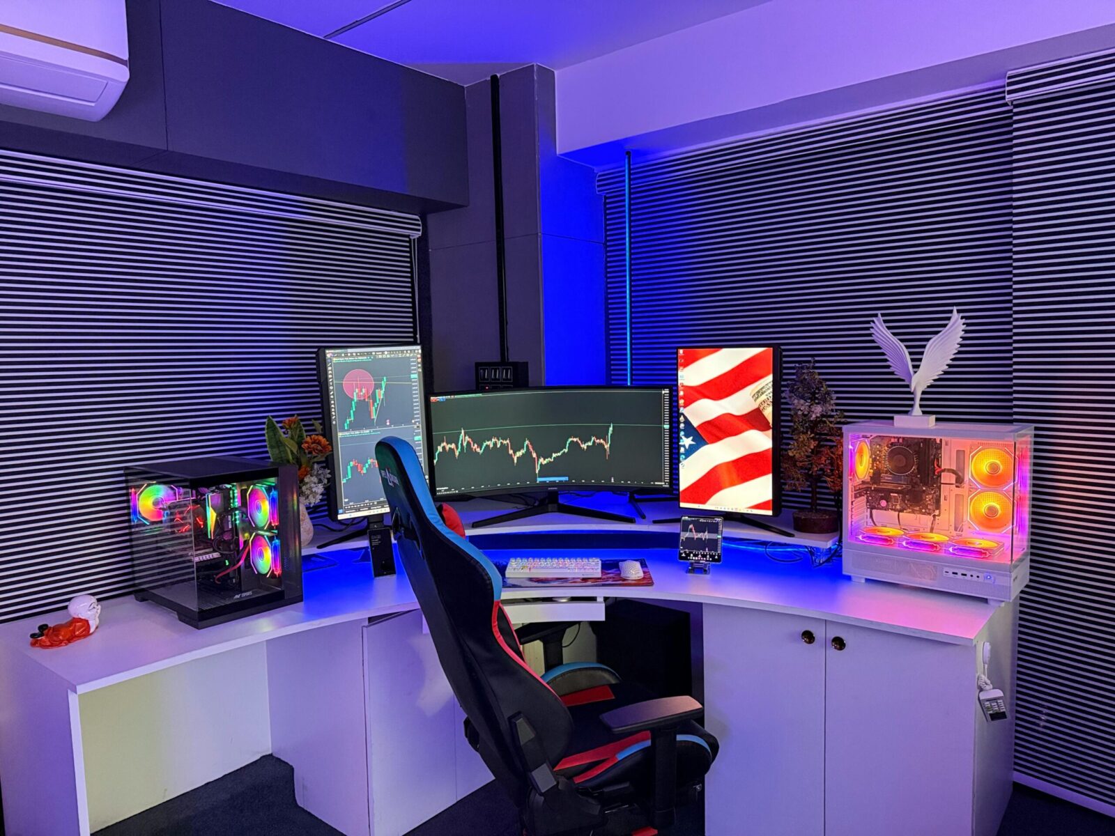A high-tech gaming and stock trading setup with RGB lighting, three monitors, and gaming chair.